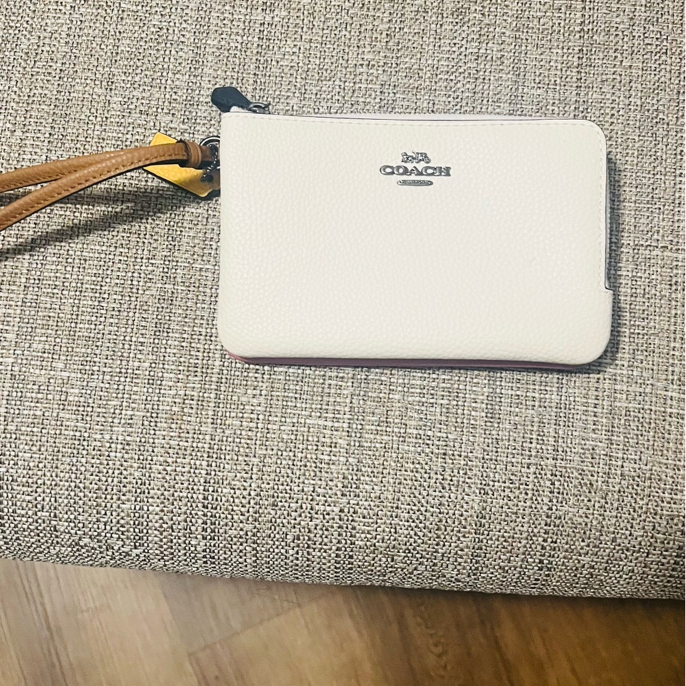 Coach pink/white wristlet